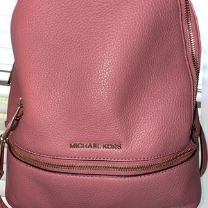 Authentic Michael Kors backpack with slip